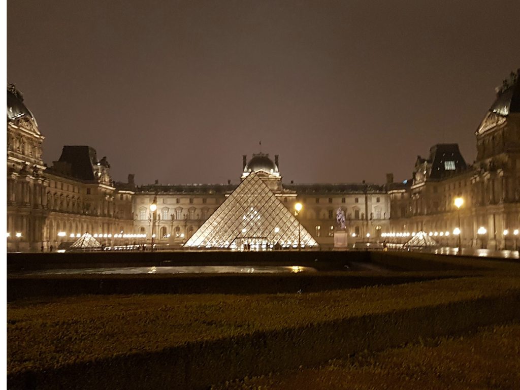 Paris at Night - Glass and light, history and dreams—the Louvre Pyramid after dark.