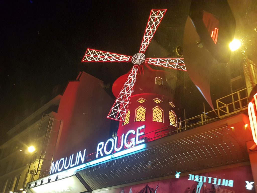 Paris glows brighter when the Moulin Rouge lights up.