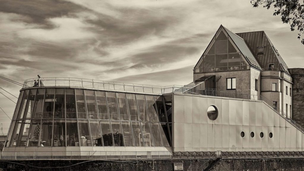 Modern chocolate museum architecture blending glass and angles—ideal for design students.