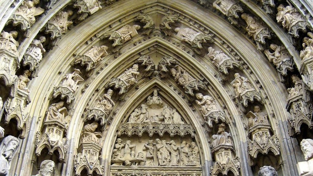 Gothic cathedral entrance with detailed stone carvings—perfect for art history trips.