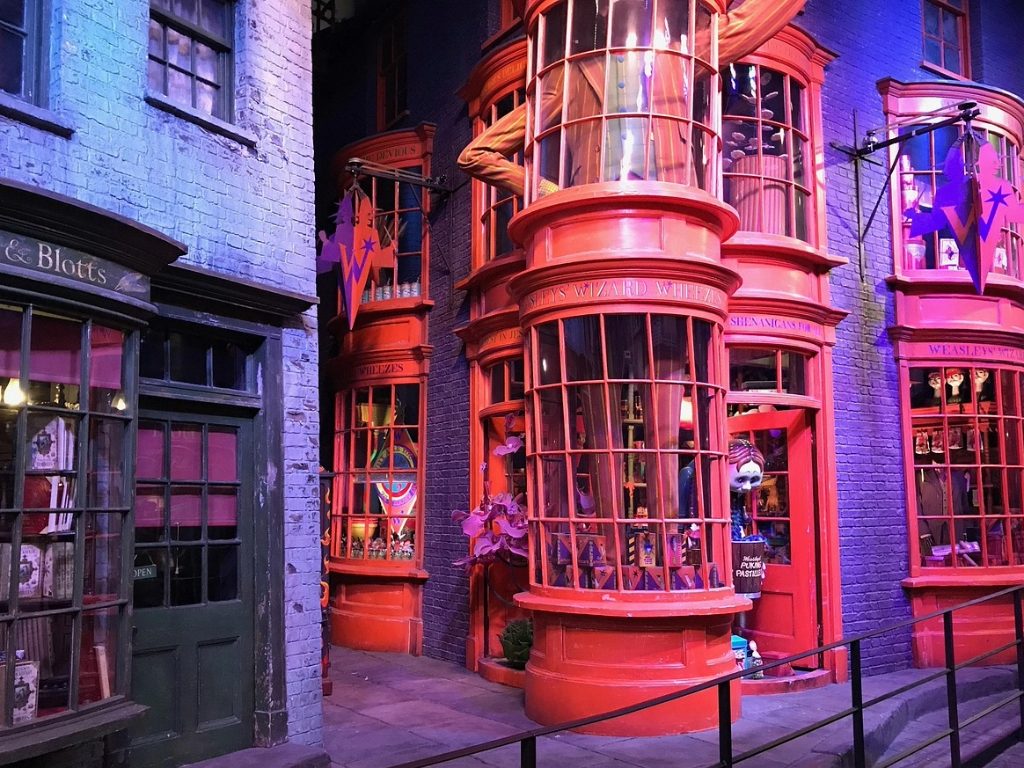 Weasleys' Wizard Wheezes glowing bright in Diagon Alley