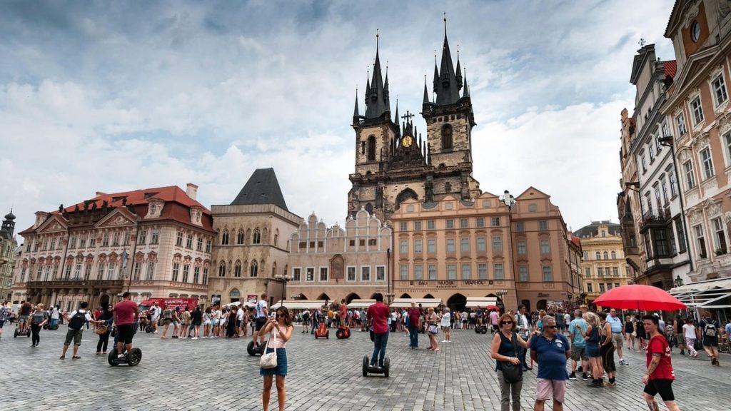 Prague's Old Town Square with its astronomical clock and Gothic church spires.