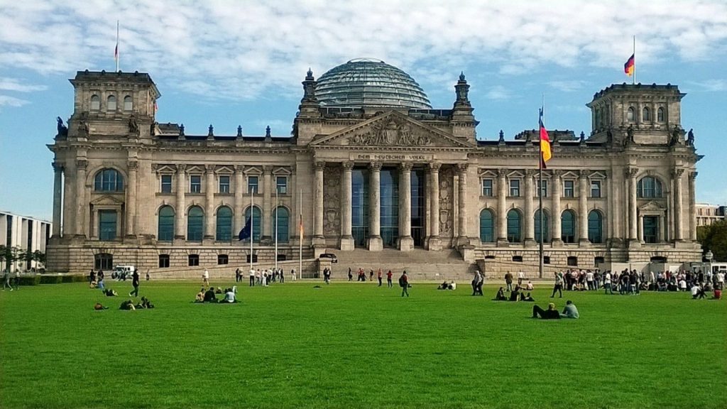 The Reichstag Building welcomes visitors on the lawn during a Berlin government study trip.