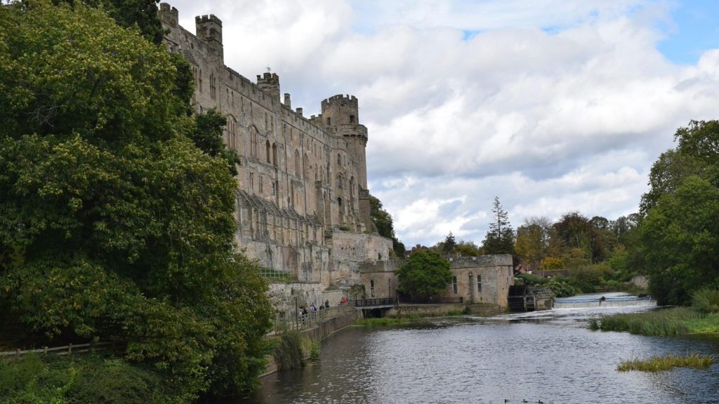 Medieval Warwick Castle looming over the River Avon.