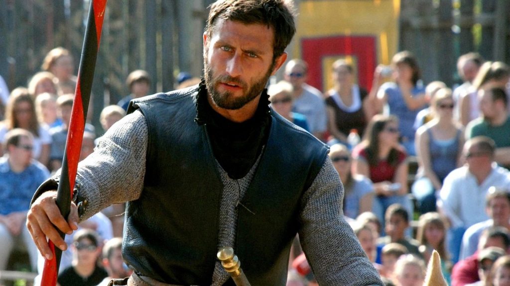 Medieval knight demonstrating historical fighting skills.